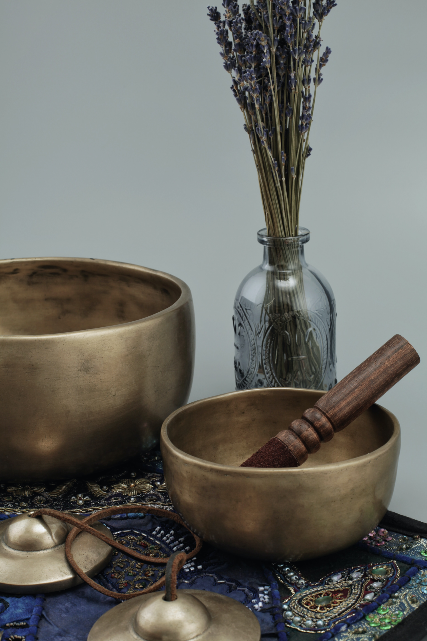 singing bowls lavender meditation bells all on a table