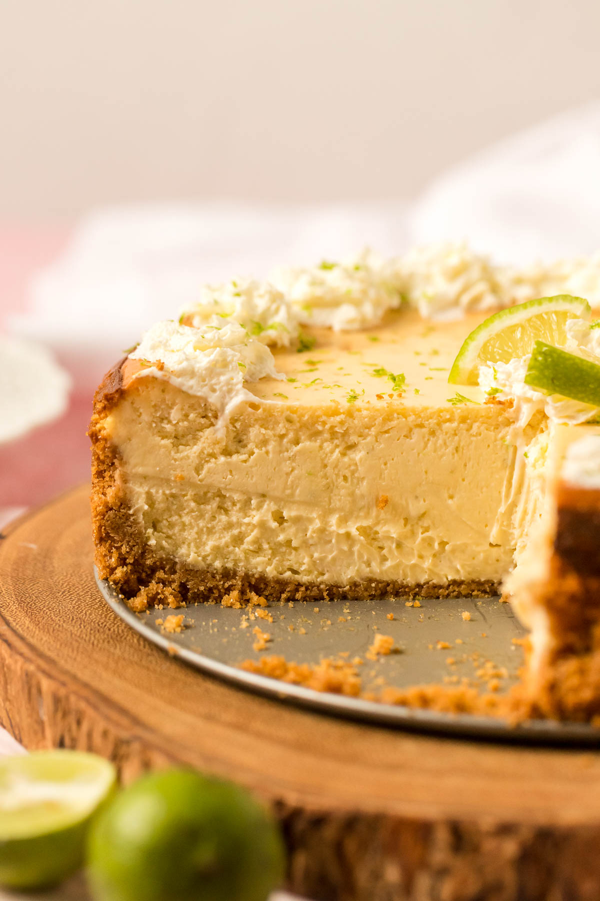 key lime pie cheesecake with slice missing so you can see inside