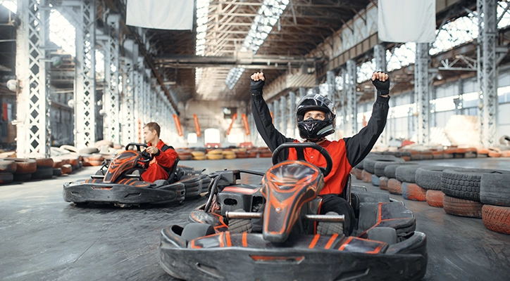 A couple of friends go-carting in San Diego