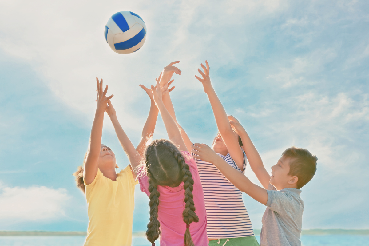 children playing with a volleyball