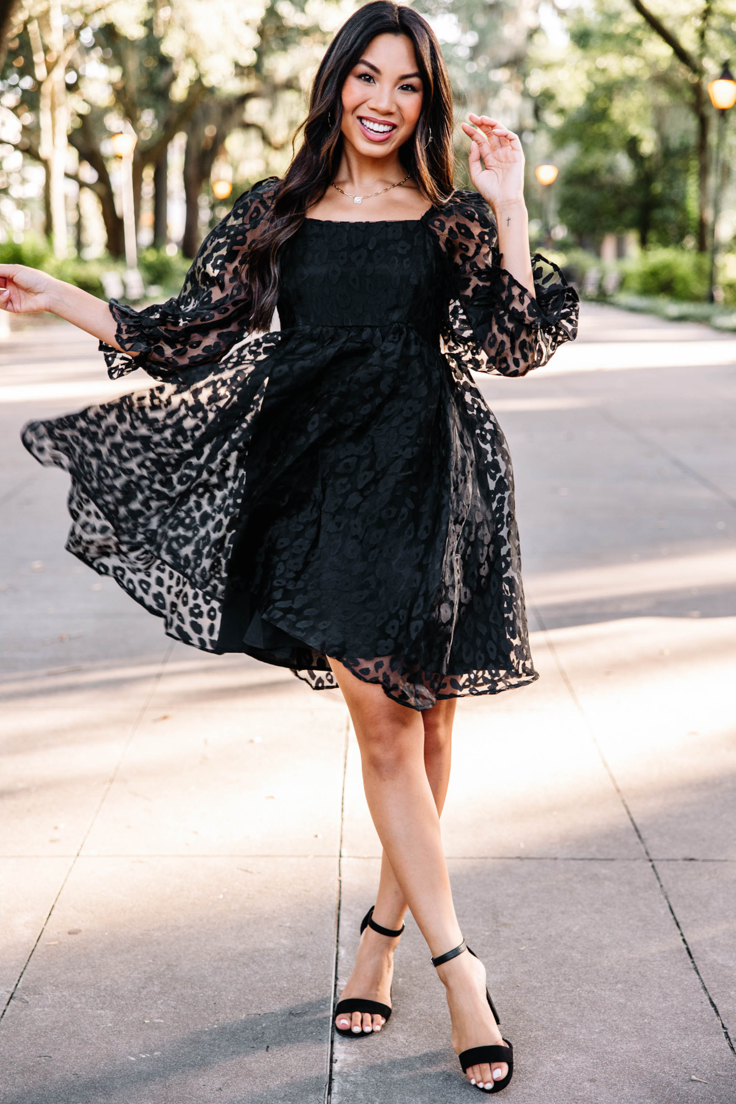 https://shopthemint.com/products/living-your-dreams-black-leopard-babydoll-dress?variant=39666261426234