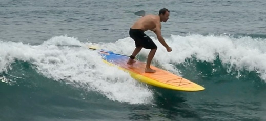 surfing an inflatable paddle board