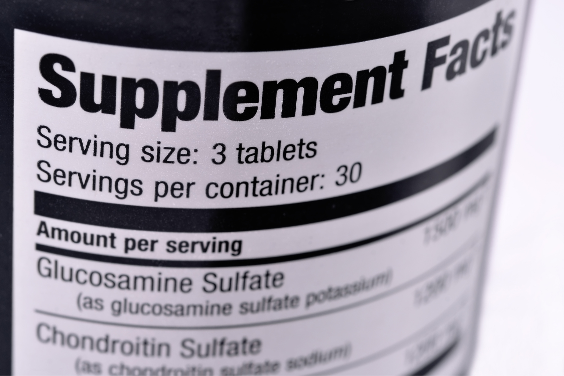 Supplement facts label showing serving size and ingredients on a dietary supplement bottle