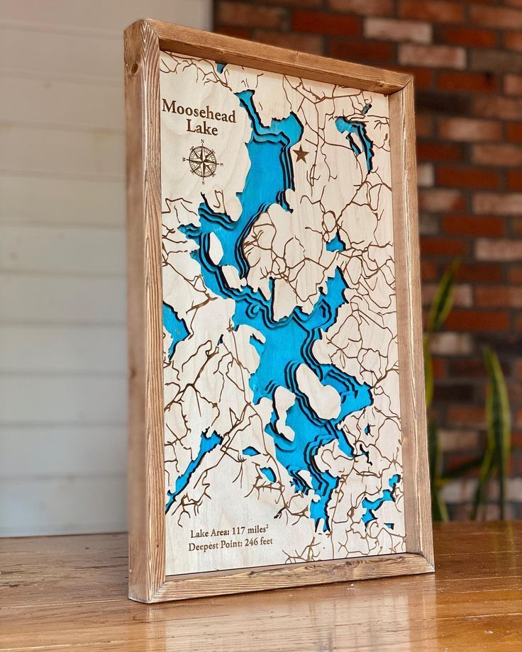 Layered lake maps on wood
