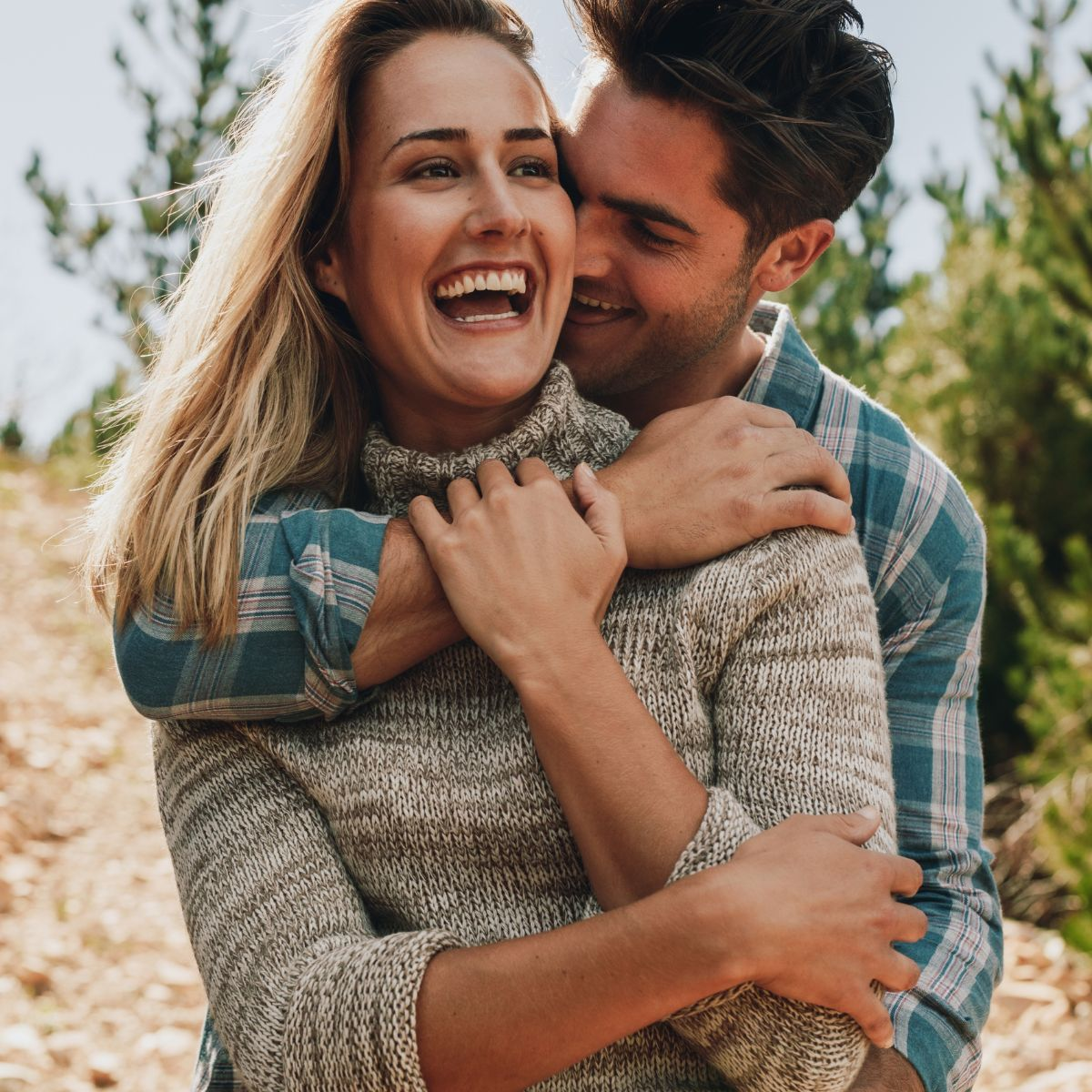 Woman and man laughing - Featured in: How Does A Taurus Man Test A Woman