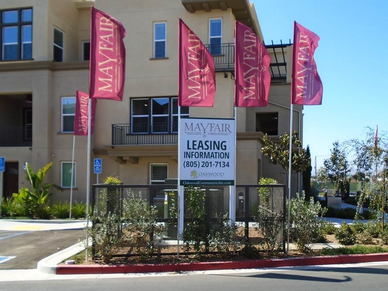 This post and panel sign for Mayfair showcases available leasing opportunities and creates a welcoming first impression at the property entrance.