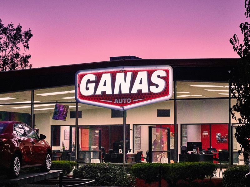 Bold and clean—our custom illuminated channel letters for Ganas Auto make the storefront instantly recognizable and shine bright in any light.