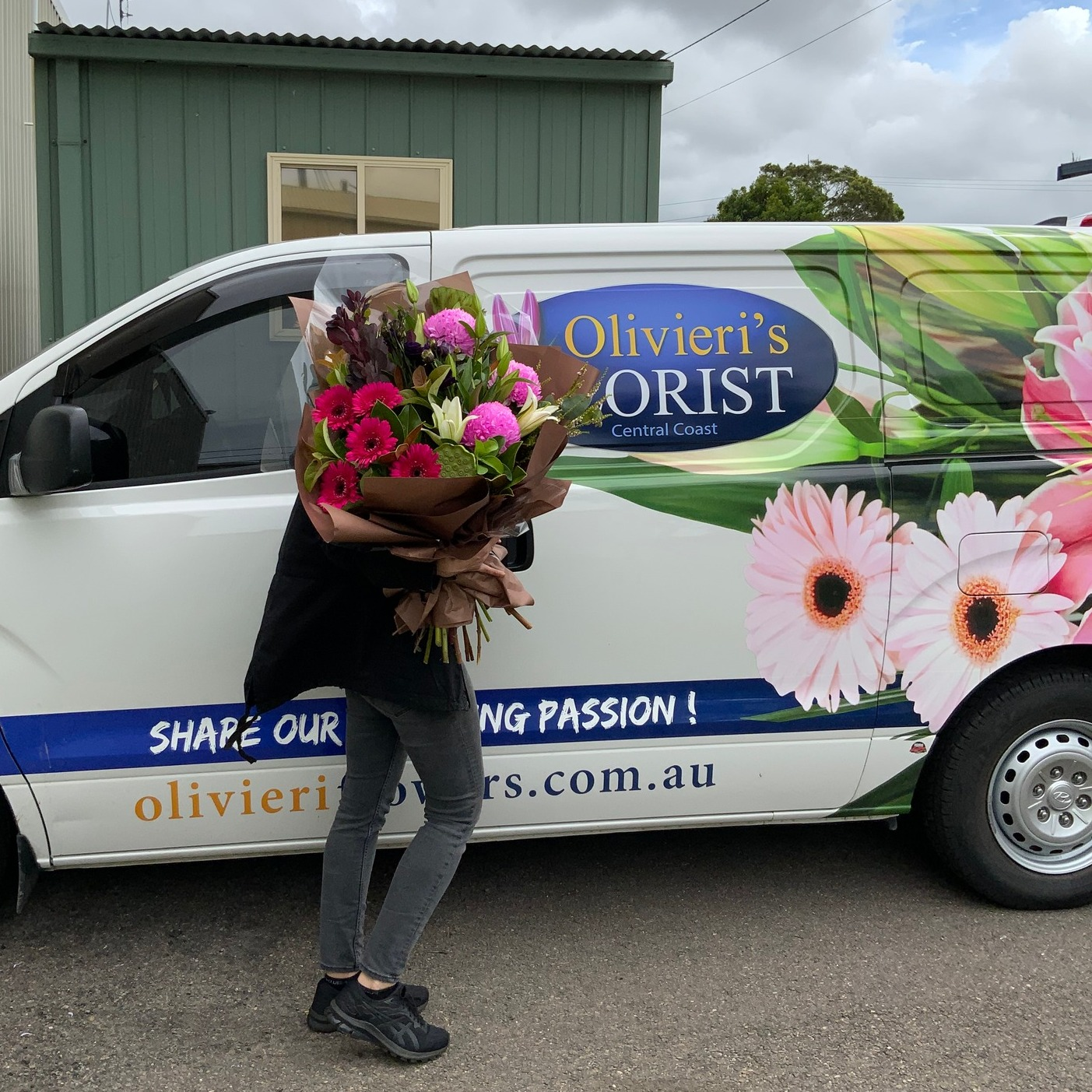 A florist delivering fresh flowers as a perfect gift