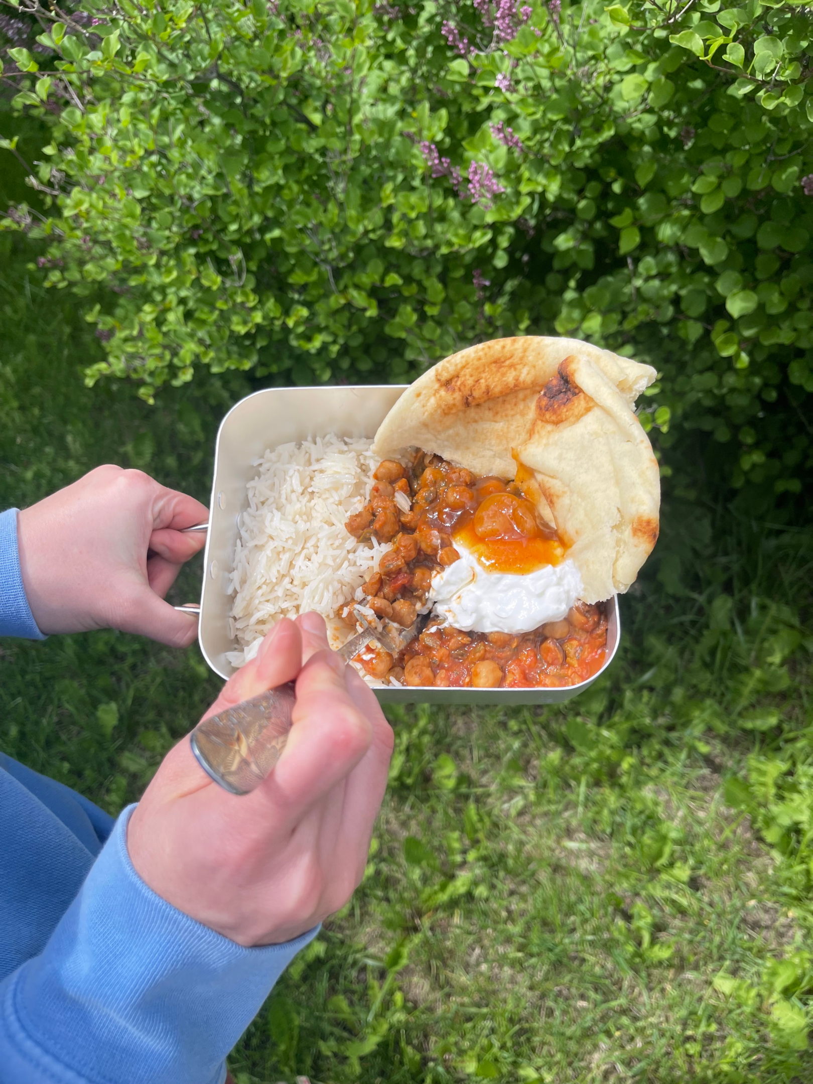 A delectable dish of Chana Masala, Basmati Rice, and Pita Bread