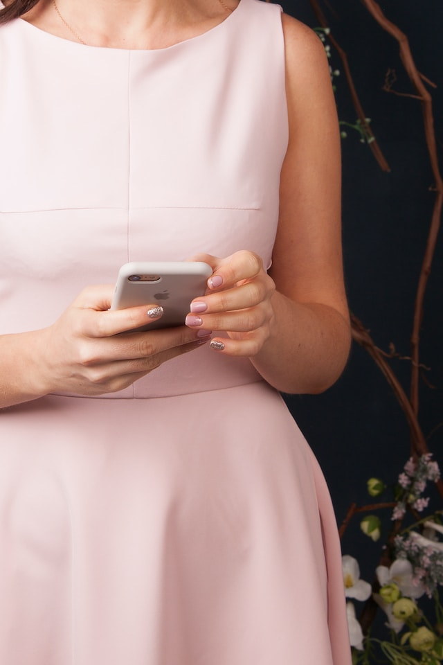 Woman with cell phone. Protecting your energy requires releasing negativity. This involves the practice of limited time online! Photo by <a href="https://unsplash.com/@shyshkina?utm_source=unsplash&utm_medium=referral&utm_content=creditCopyText">Tetiana SHYSHKINA</a> on <a href="https://unsplash.com/photos/NQ-hG9B1iiw?utm_source=unsplash&utm_medium=referral&utm_content=creditCopyText">Unsplash</a> 