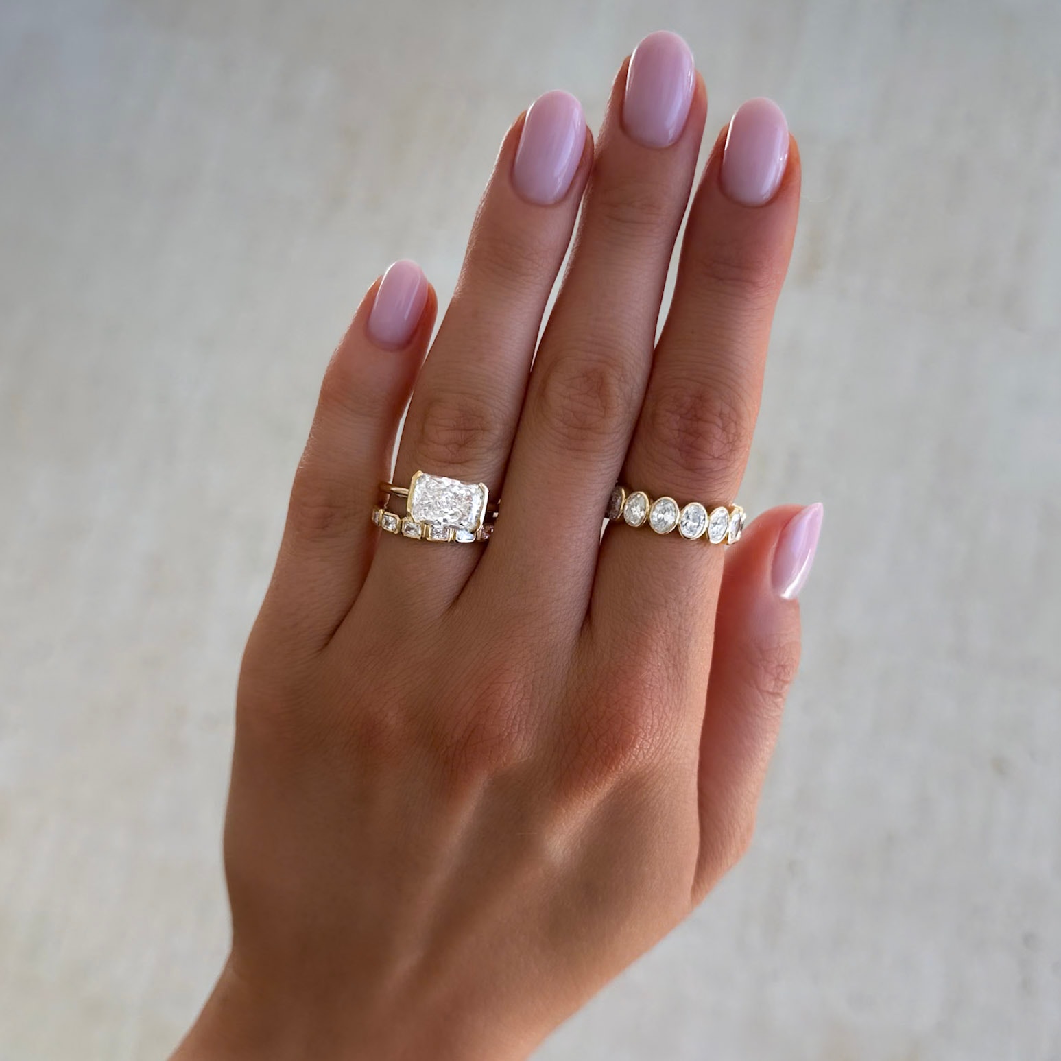 East West Half Bezel Solitaire Engagement Ring With Elongated Radiant Cut Diamond