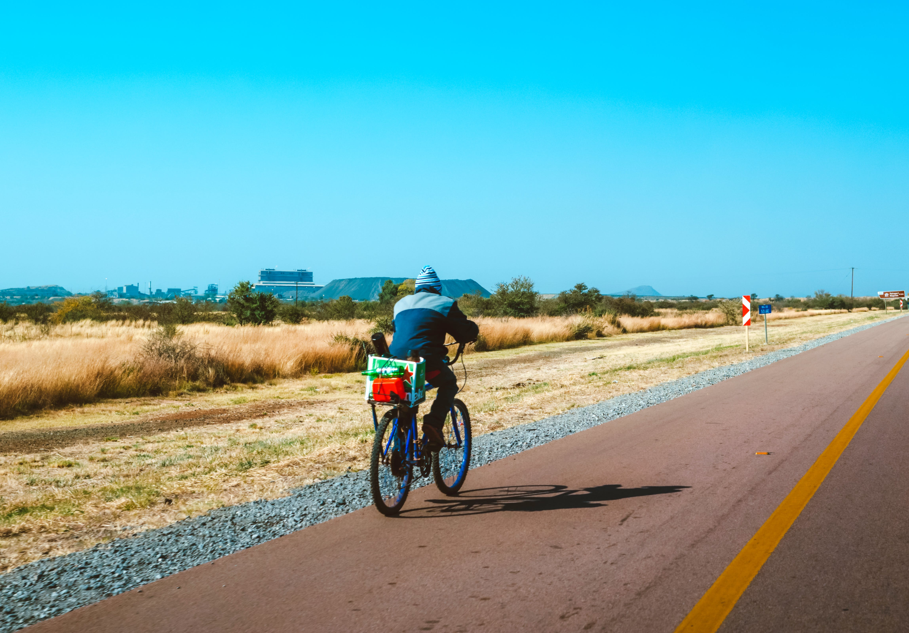 A man riding his bike on an African road to illustrate countries in Spanish in that part of the world.