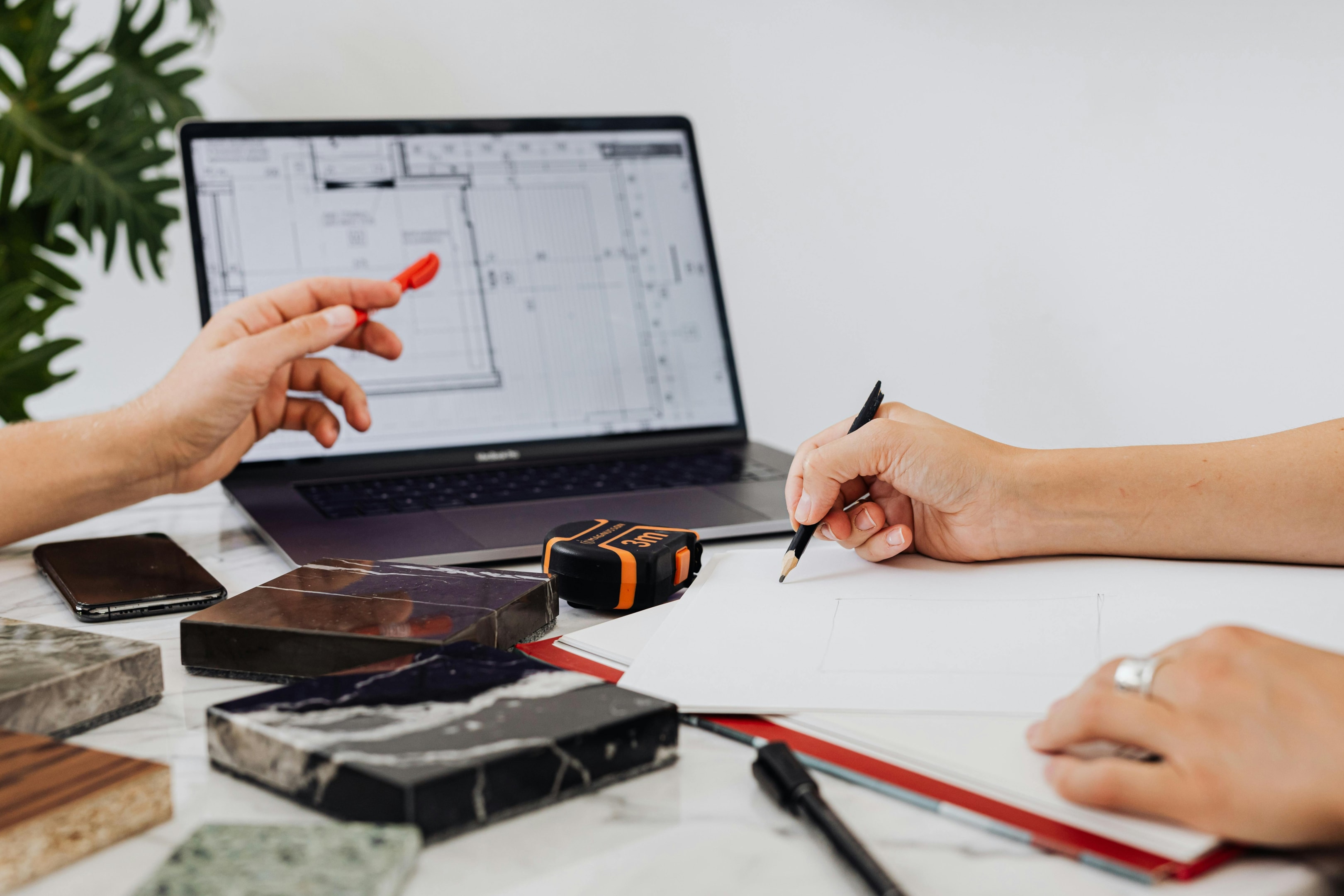 Real estate investors planning their fix-and-flip property renovation.