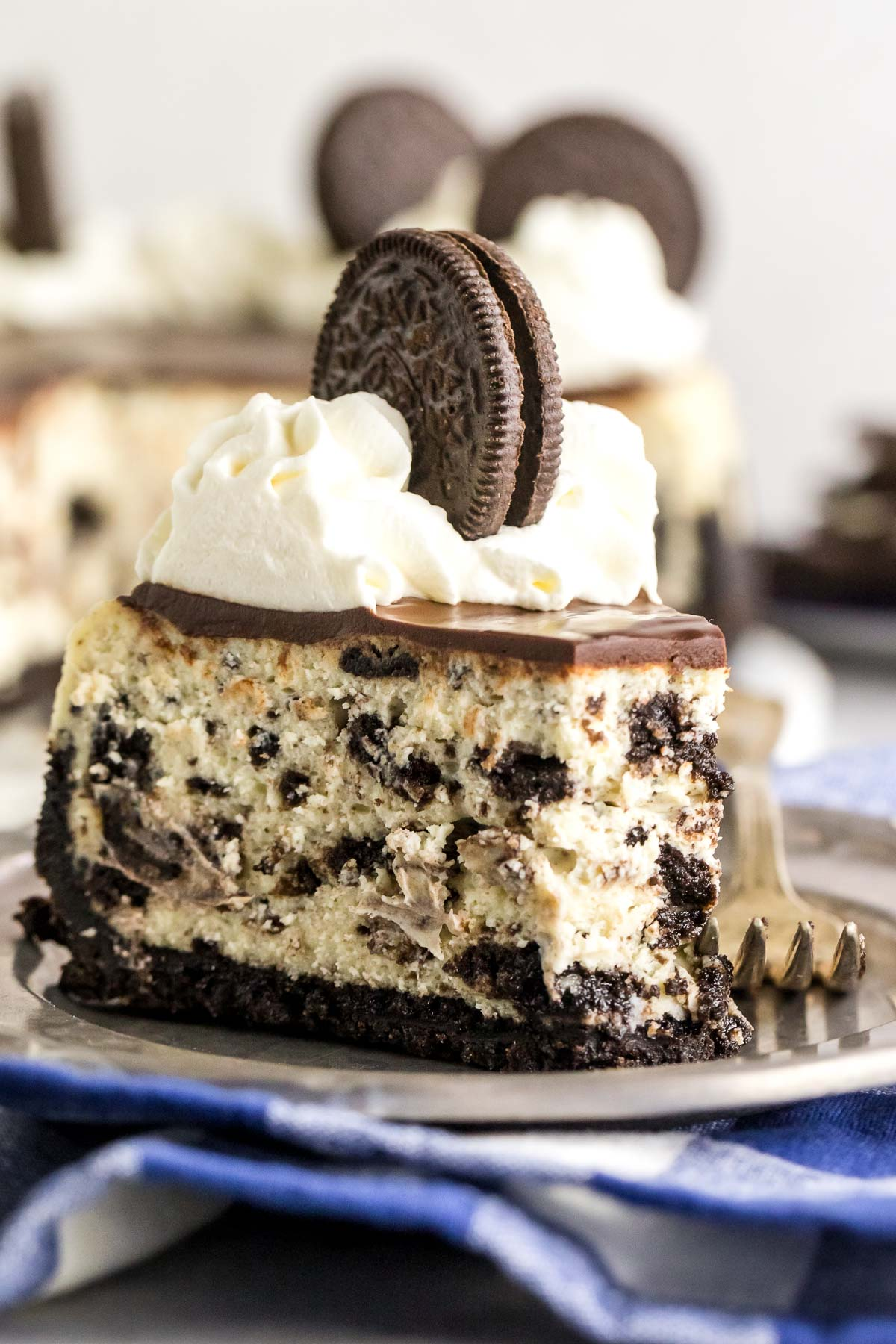 slice of Oreo cheesecake with a bite gone