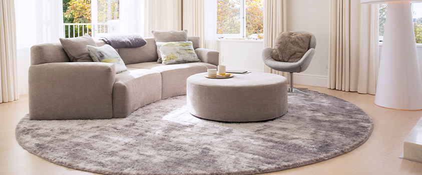 The "All Legs on the Rug" layout is ideal for most living rooms, especially those with sectional and modular sofas.