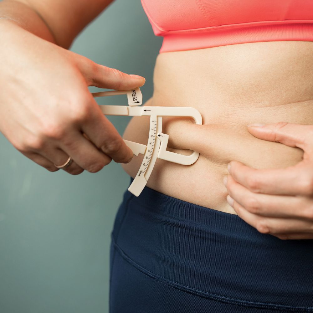 A person measuring their body mass index