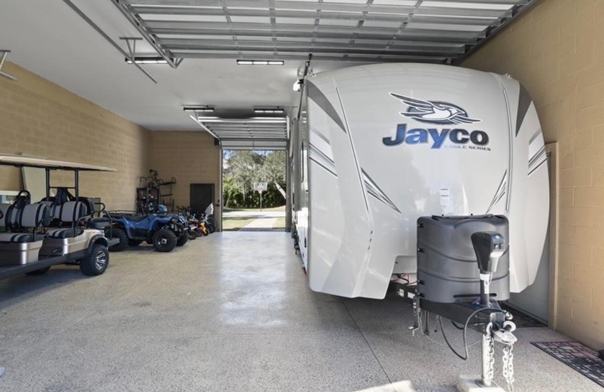 The image depicts an elegant gated entrance to a community, featuring lush landscaping and prominent security features, ideal for prospective properties consumers in North Fort Myers. This inviting entryway reflects the charm of the Skyline Woods area, ensuring a secure and attractive environment for residents.