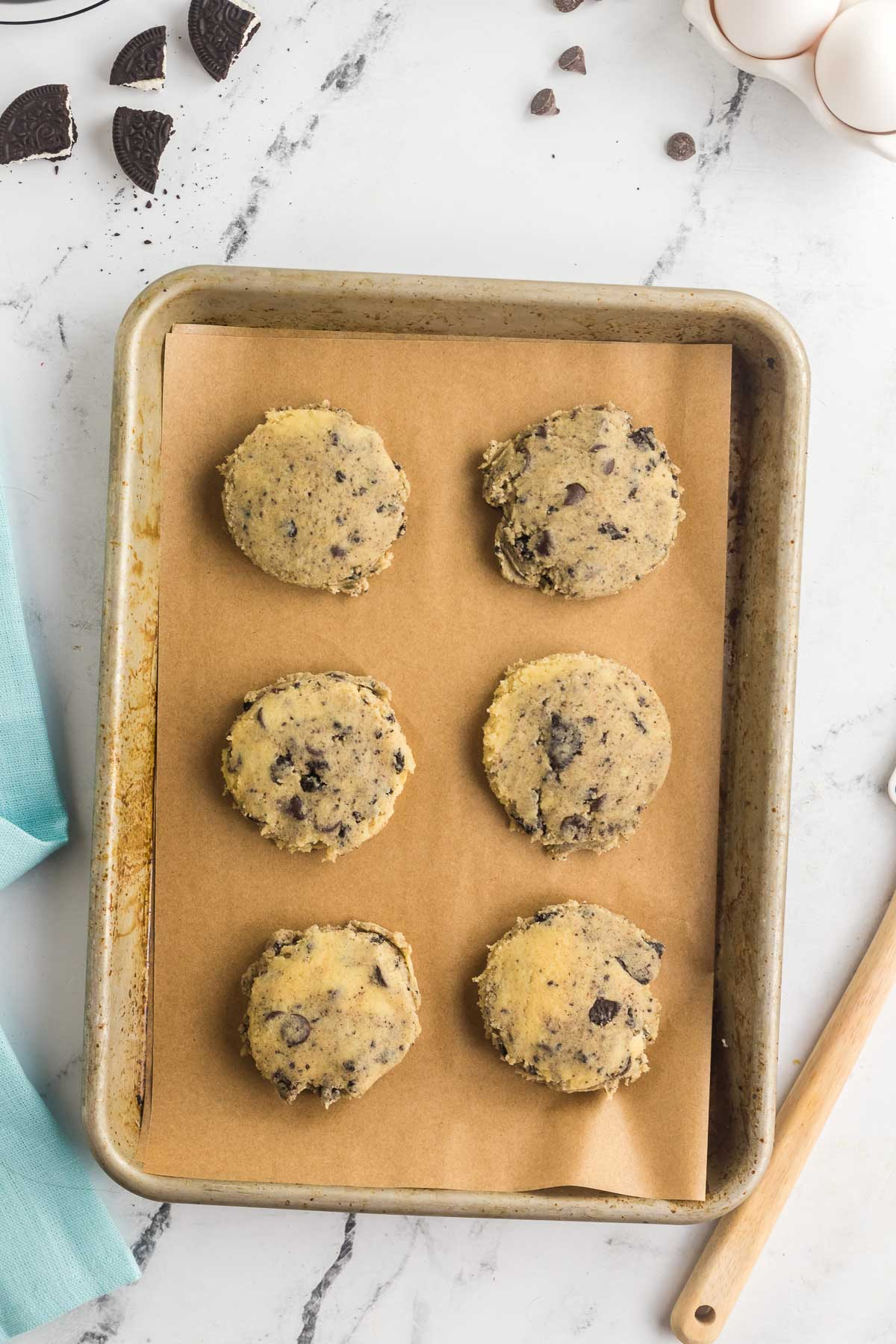 six oreo cookie cheesecake cookie dough balls flattened