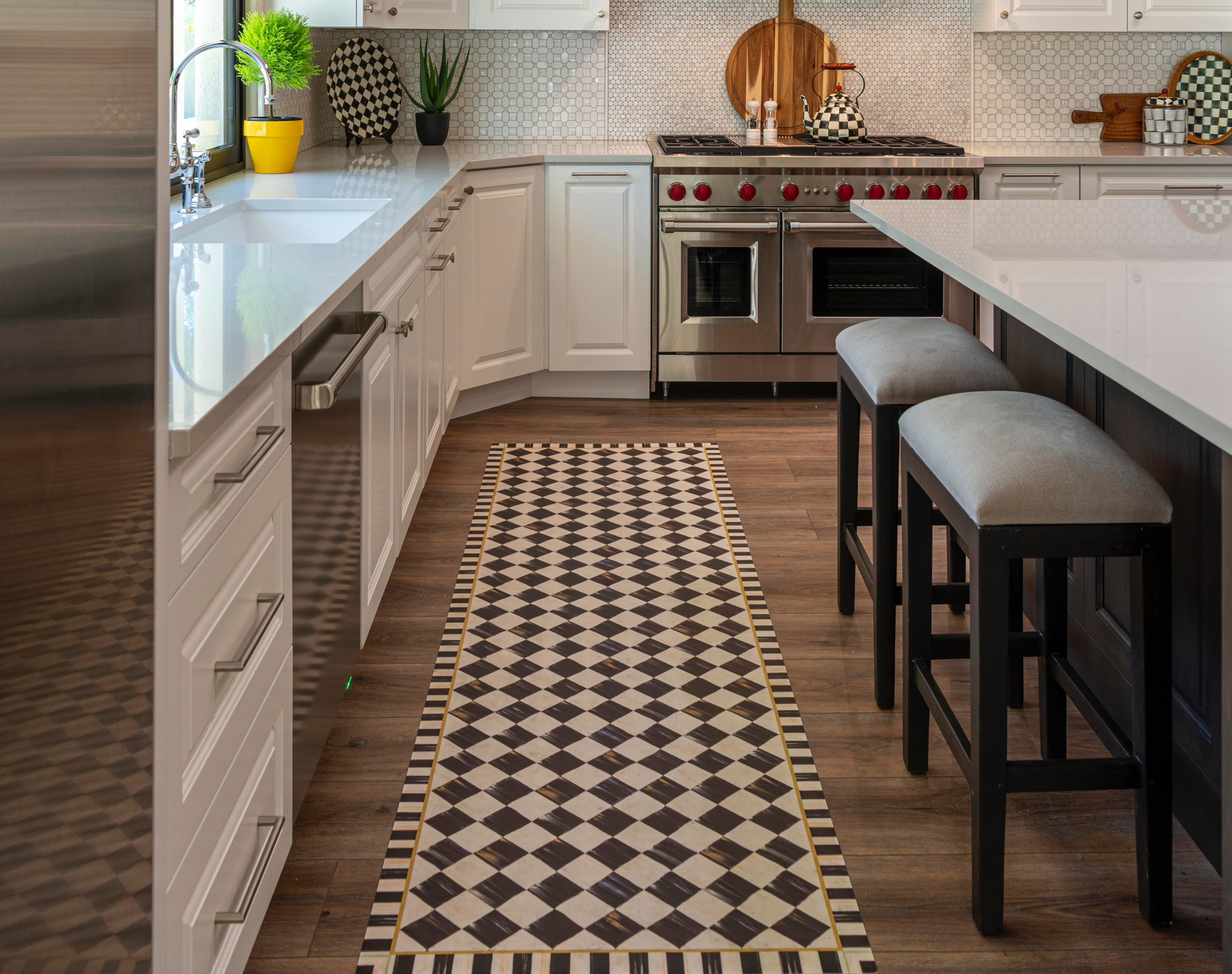 kitchen with white cabinets and patterned runner