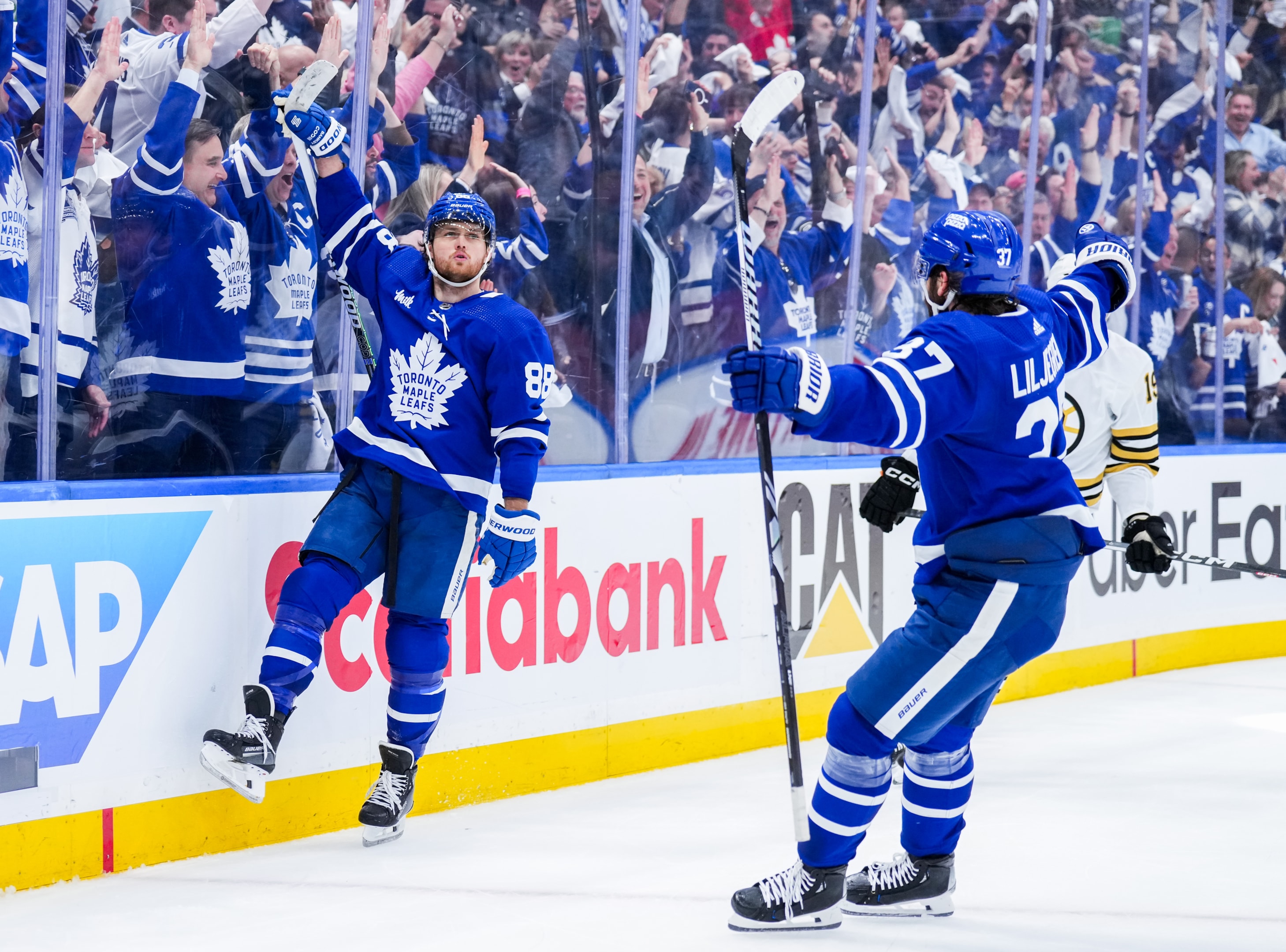 William Nylander of the Toronto Maple Leafs celebrates his goal against the Boston Bruins with teammate Timothy Liljegren during the second period in Game Six of the First Round of the 2024 Stanley Cup Playoffs at Scotiabank Arena on May 2, 2024 in Toronto, Ontario, Canada.