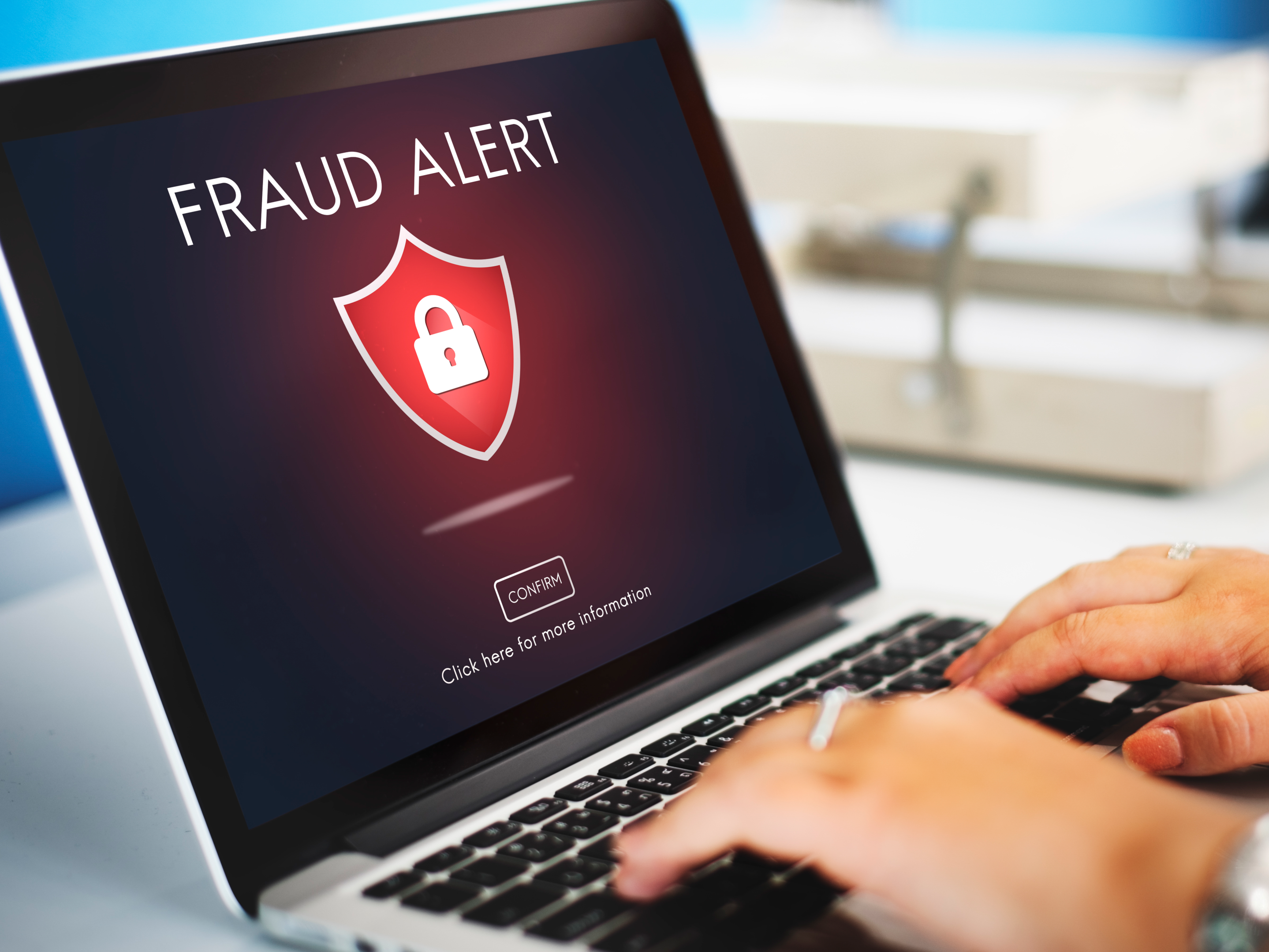 "fraud alert" highlighted on a laptop screen