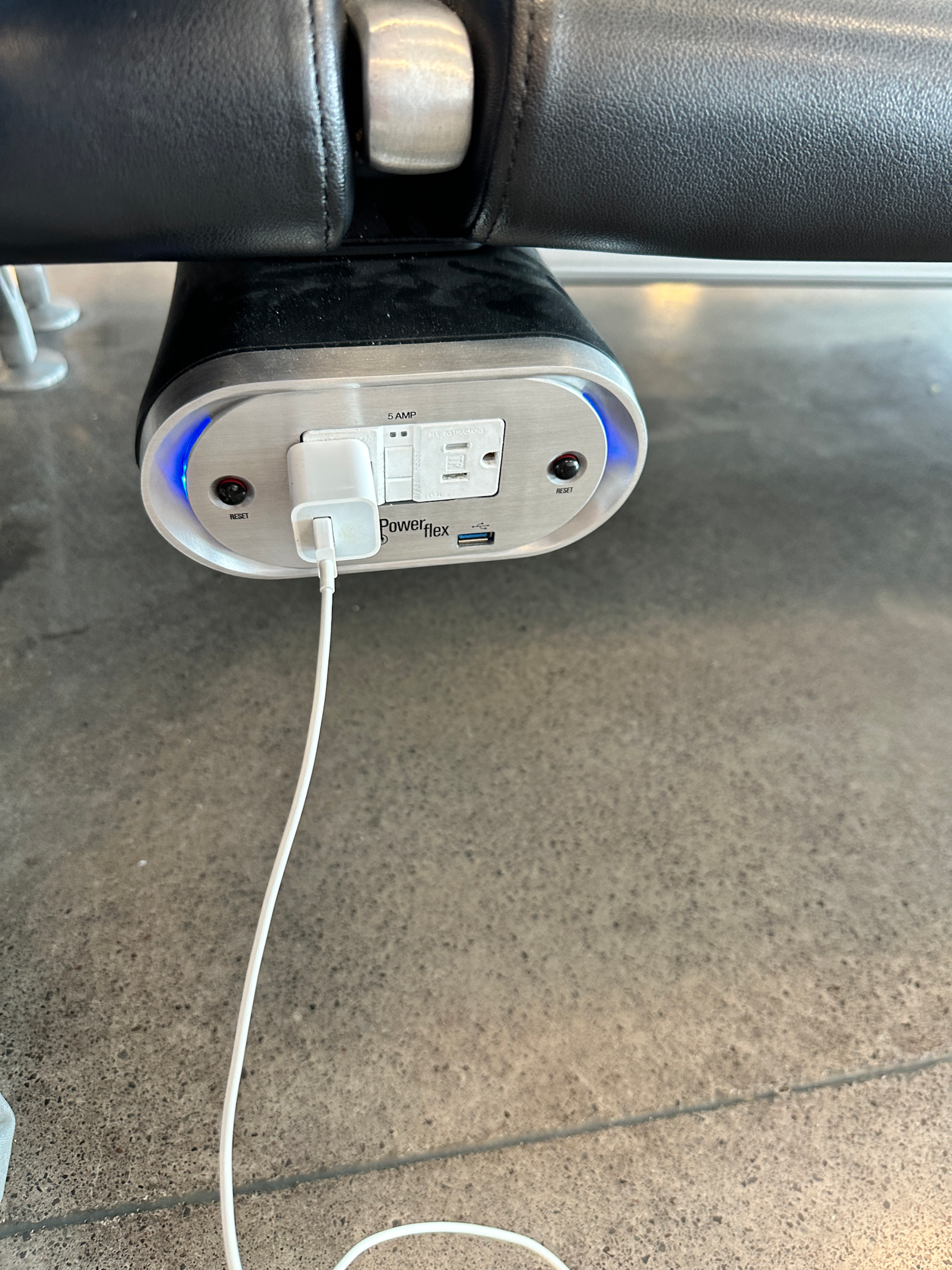 Gate 11 charging port at the Kona International Airport