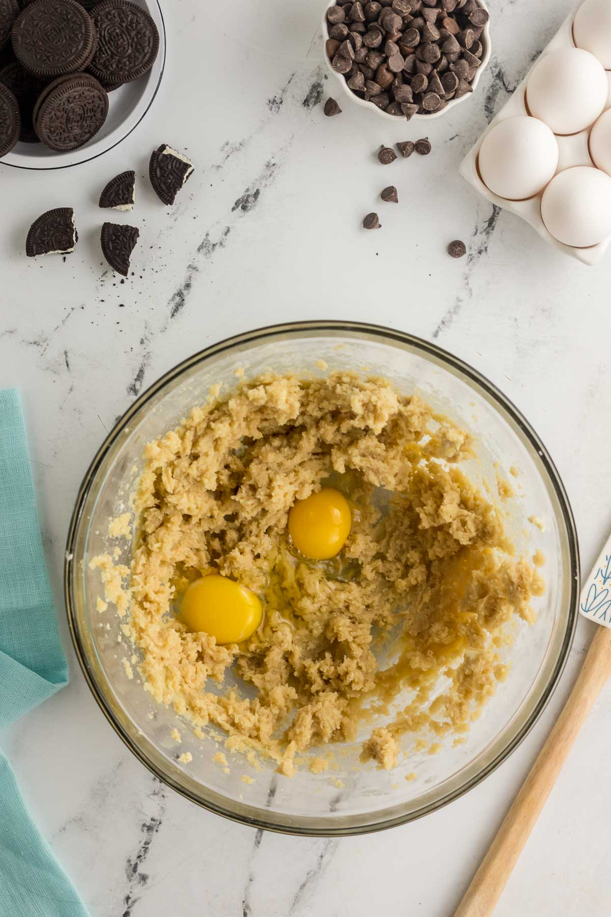 egg and egg yolk added to cookie dough in large bowl