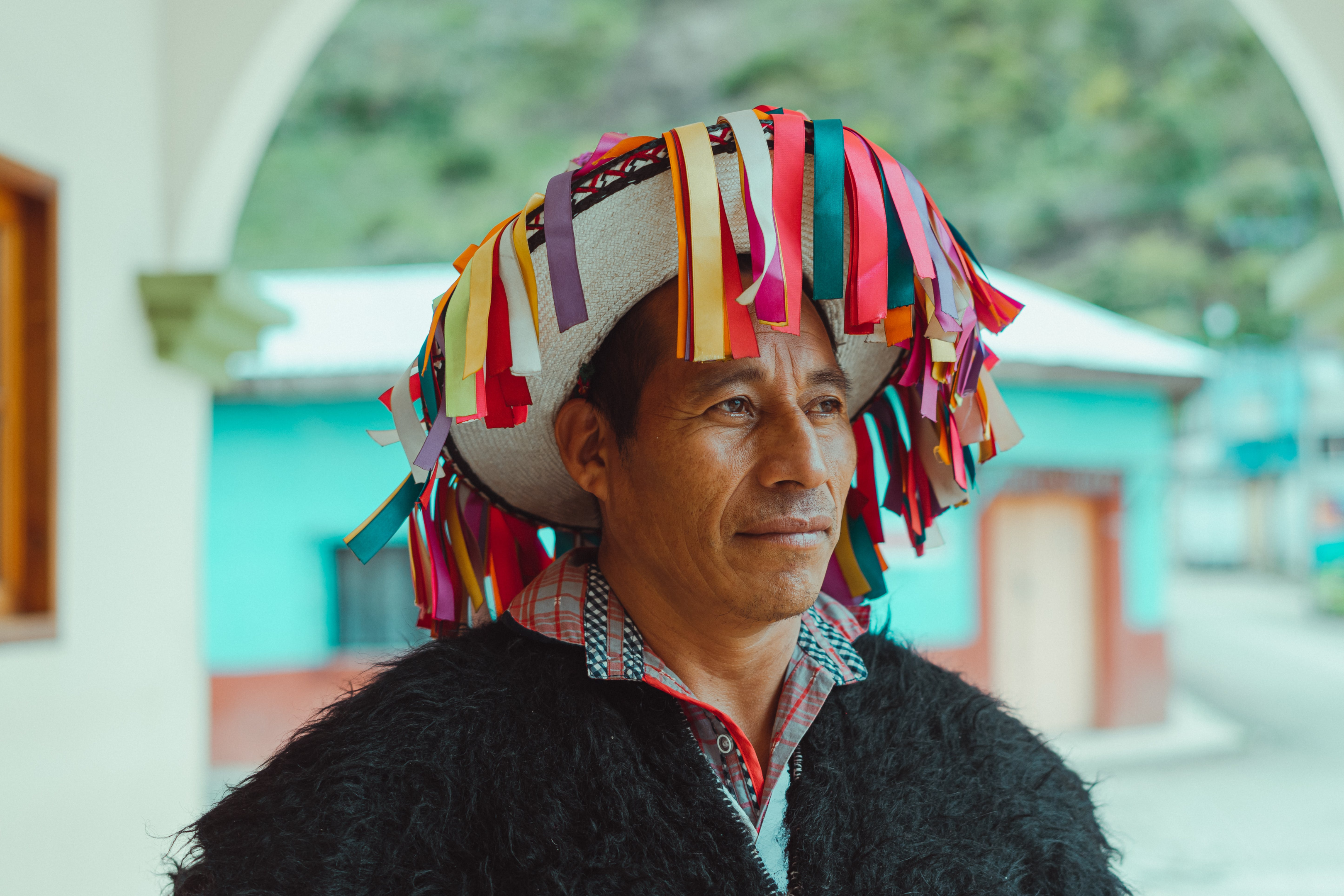 Man wearing a colorful hat to illustrate the Spanish countries in Central America.