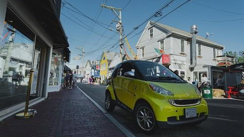 Little car parked on Commercial Street in Provincetown