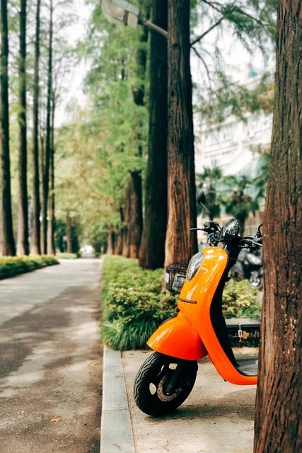 An electric scooter parked outside.