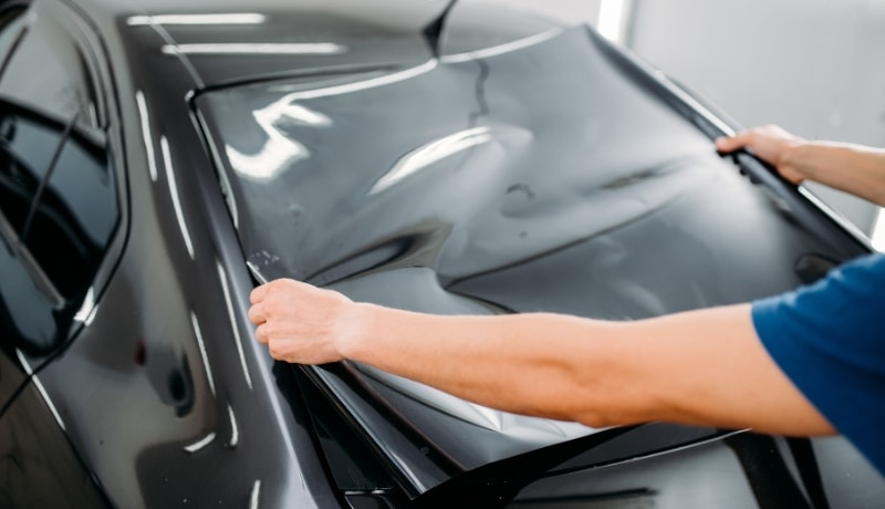 Installation of reflective window glass film on front screen