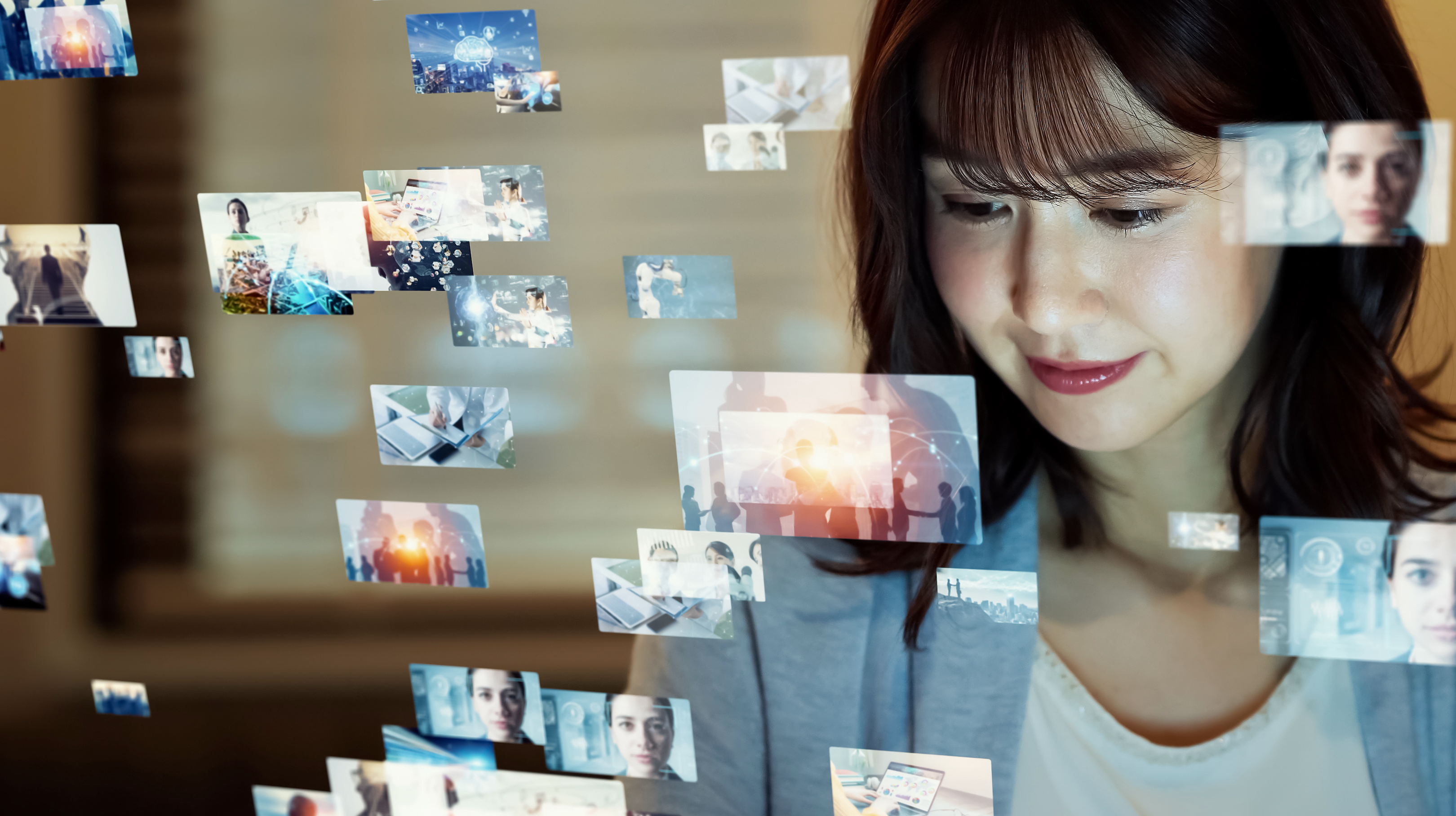 a woman watches multiple screens simultaneously