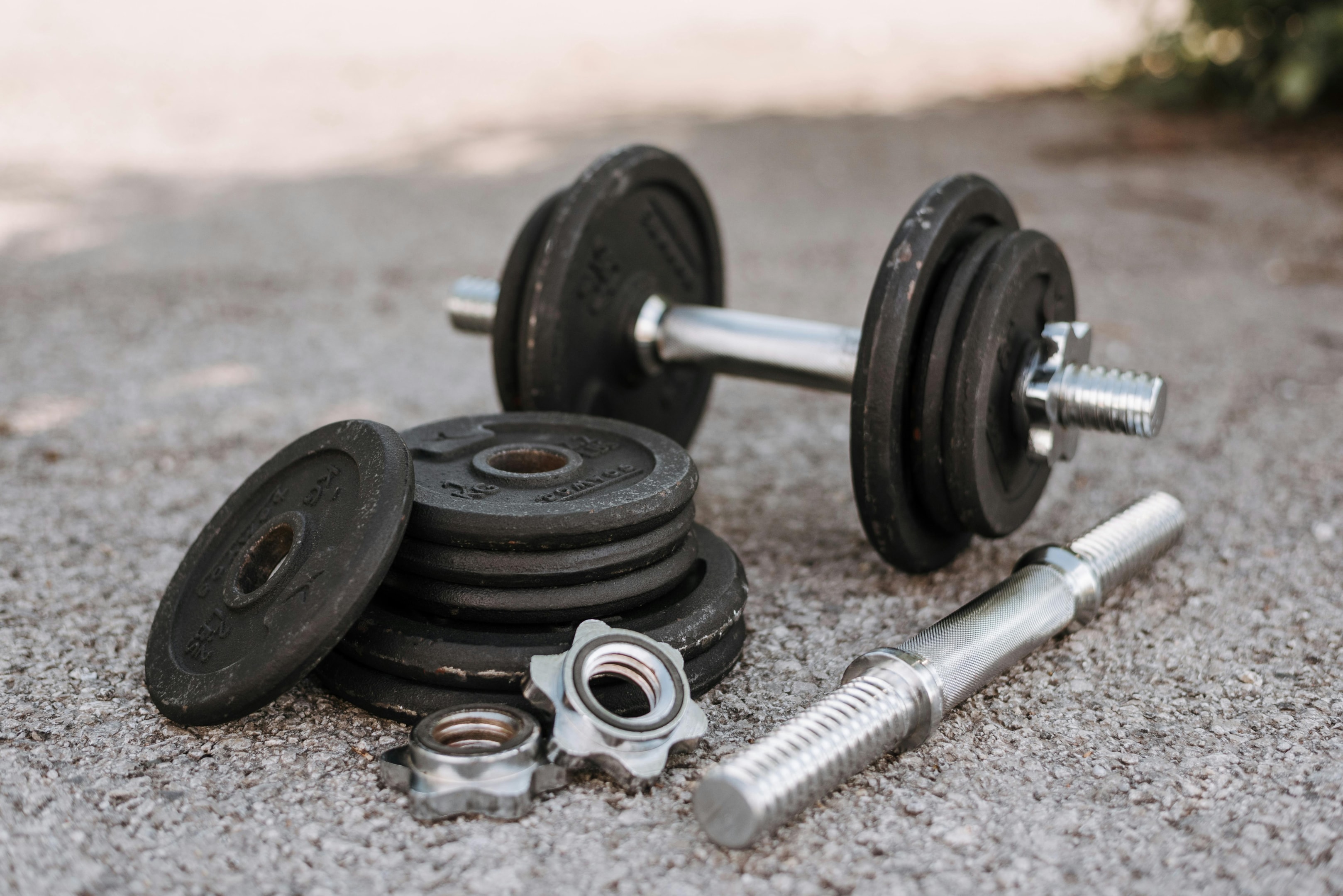 Photo by Anete Lusina: https://www.pexels.com/photo/dumbbell-near-plates-and-metal-collars-on-asphalt-4793234/