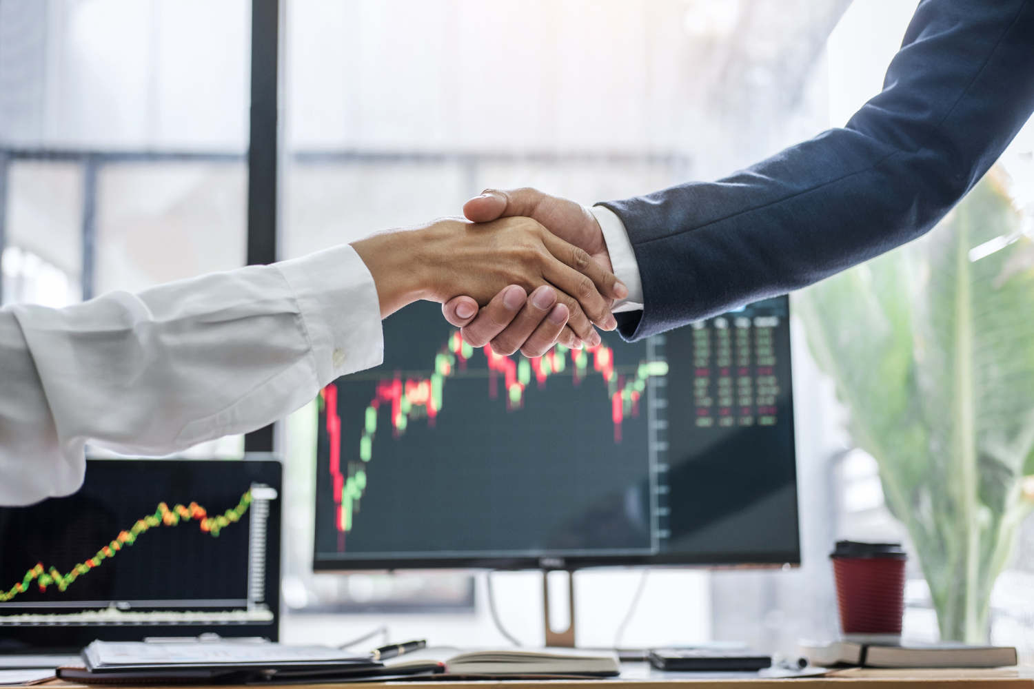 Two business professionals shaking hands.