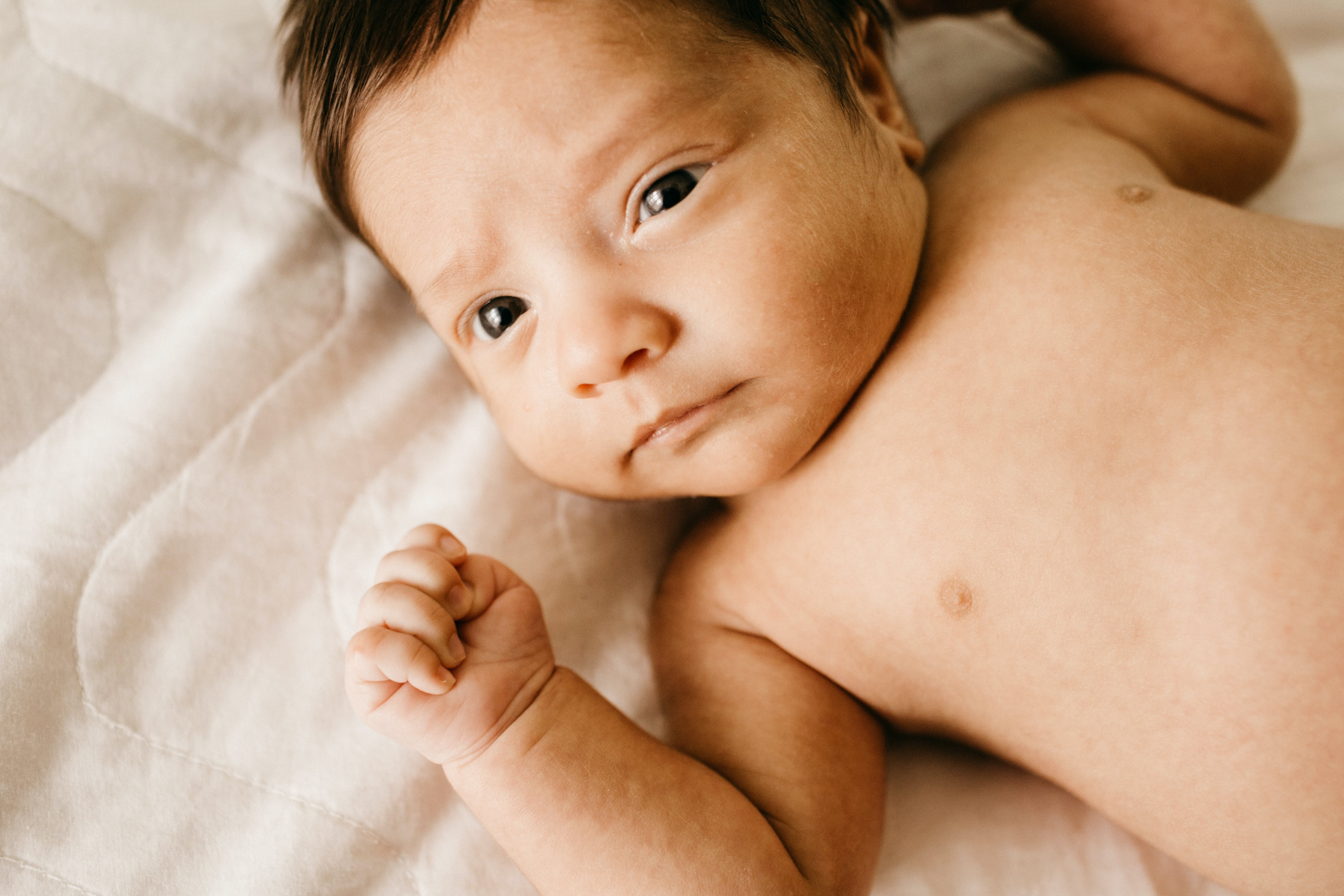 Photo by Jonathan Borba: https://www.pexels.com/photo/close-up-photo-of-topless-baby-lying-on-a-bed-3763590/