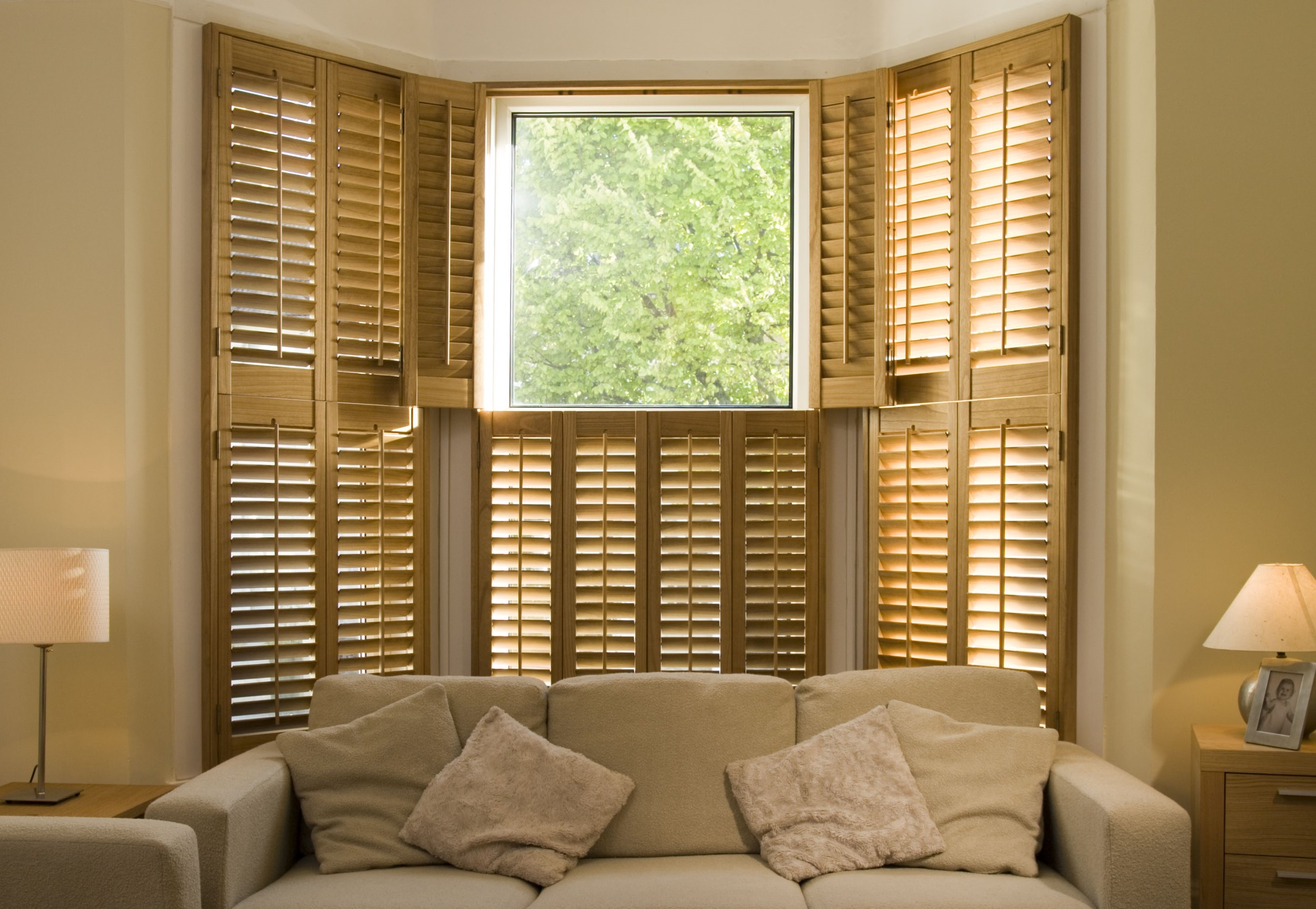 Wood plantation shutters on bay window