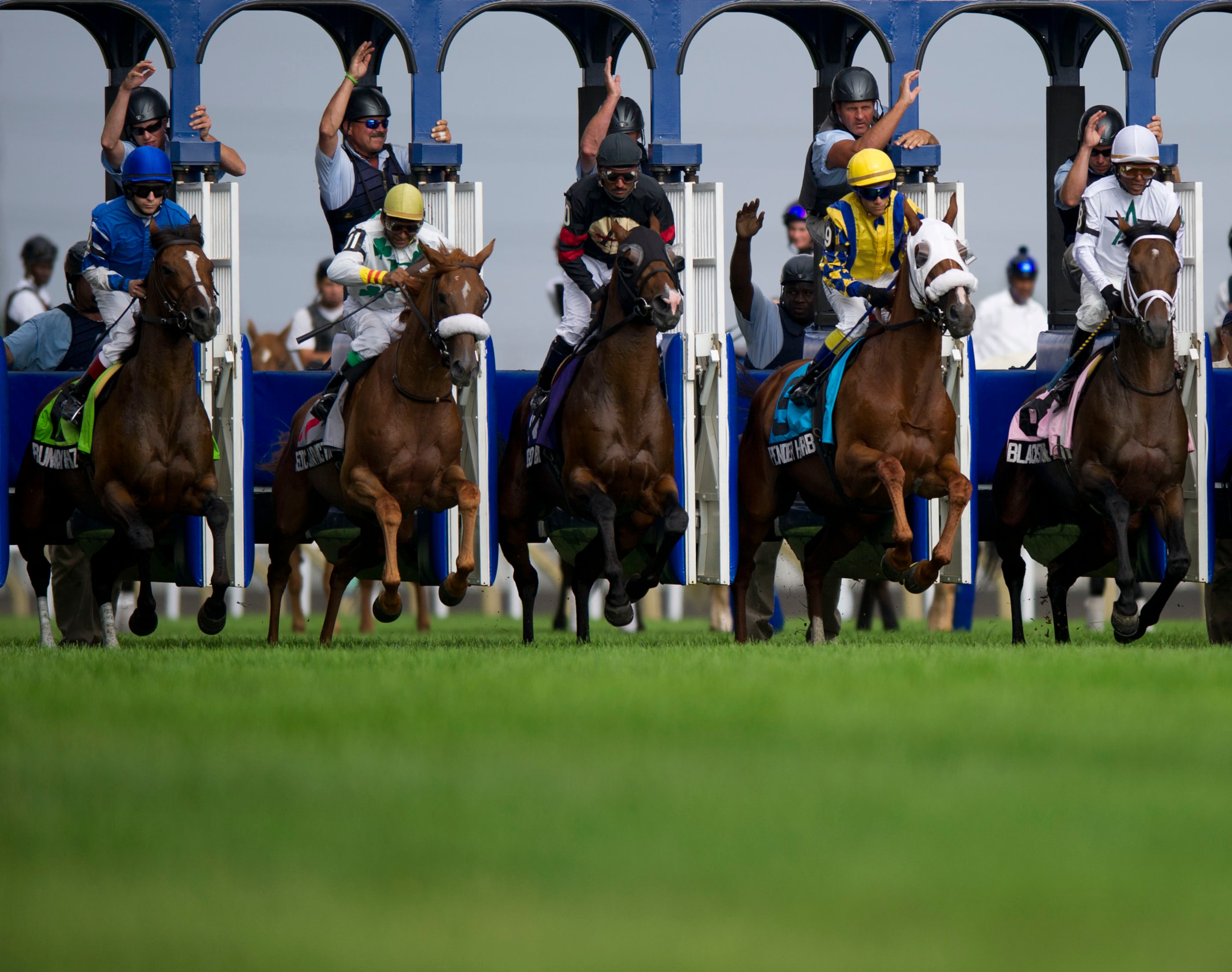 The horses and jockey's burt out of the gates at the start of the 120th Running of the Breeders' Stakes at the Woodbine Racetrack.