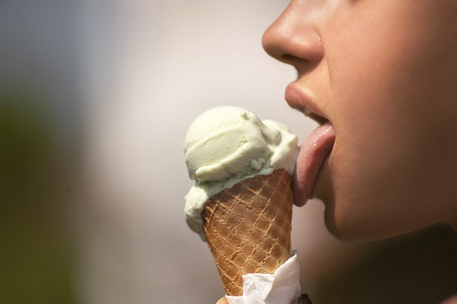 A profile image of a person eating a vanilla ice cream cone. 