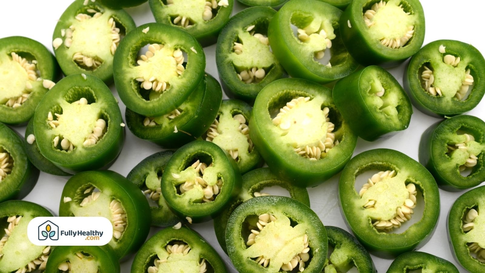 Close-up of sliced raw jalapeño peppers with visible seeds