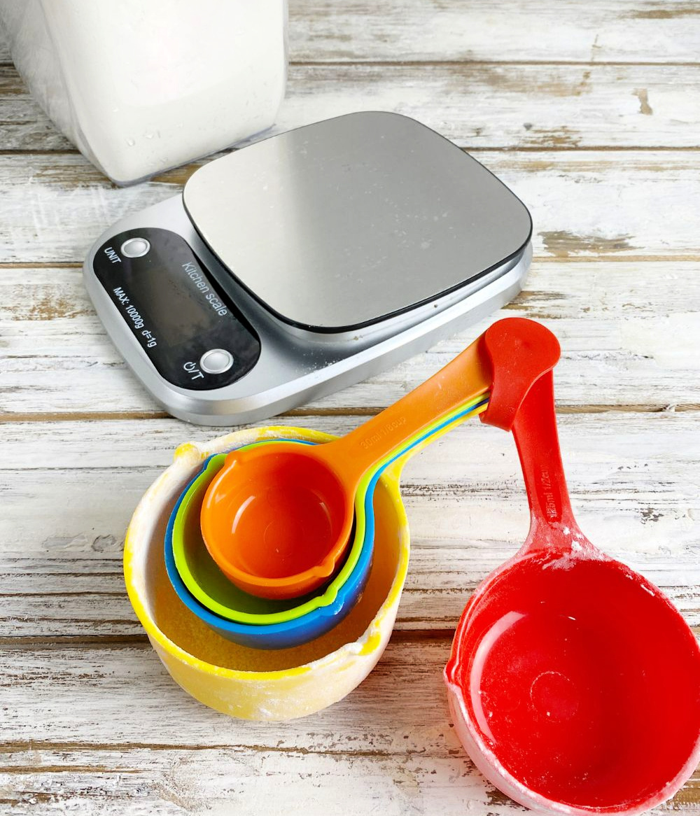 a kitchen scale and a set of dry measuring cups