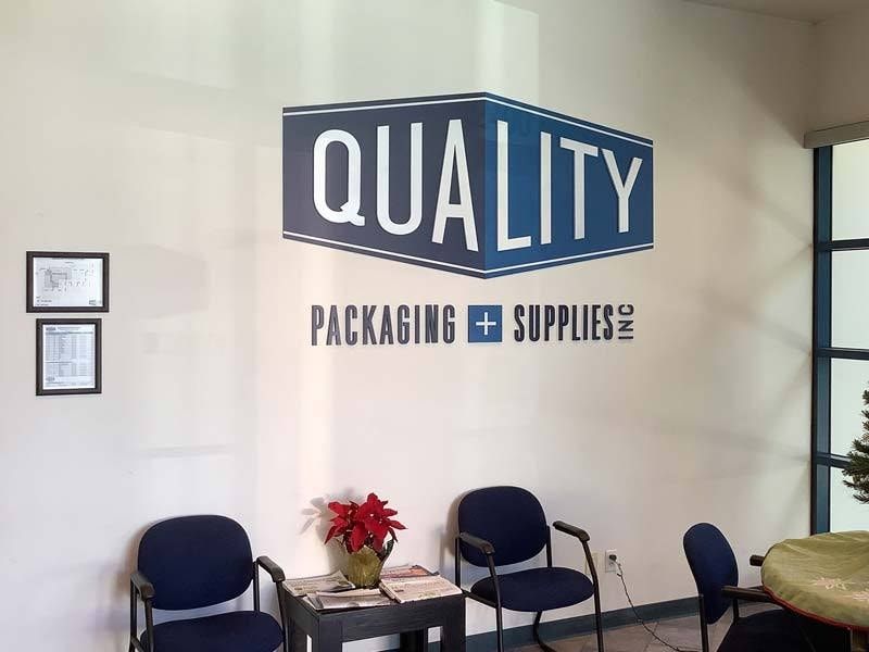 Custom interior lobby sign for Quality Packaging & Supplies in Oxnard featuring dimensional lettering that adds a polished, professional touch to their front office.