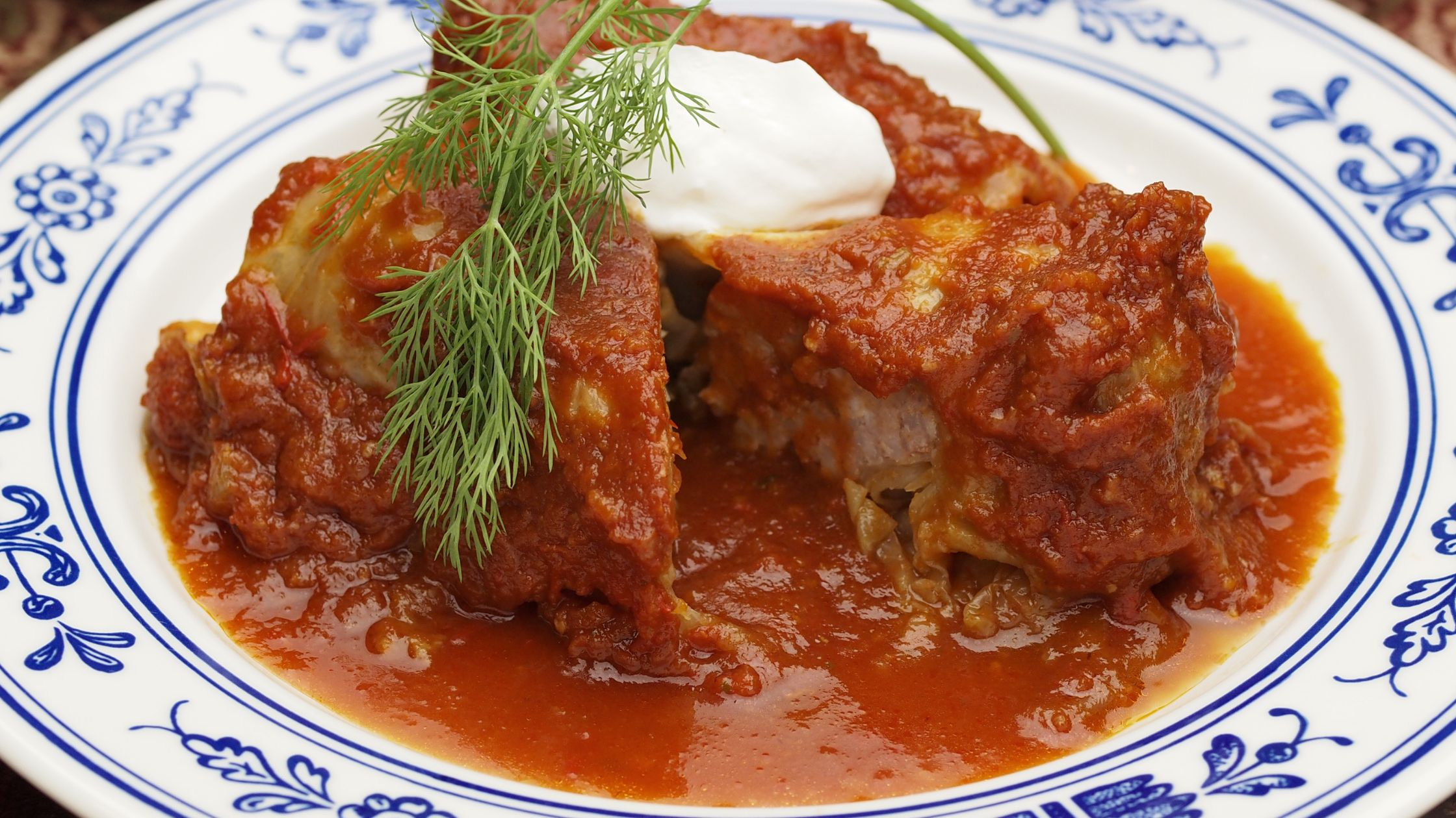 Gołąbki are served with a rich tomato sauce