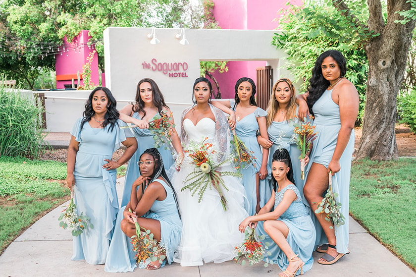 Bridal party in matching outfits, ready for wedding day photos.