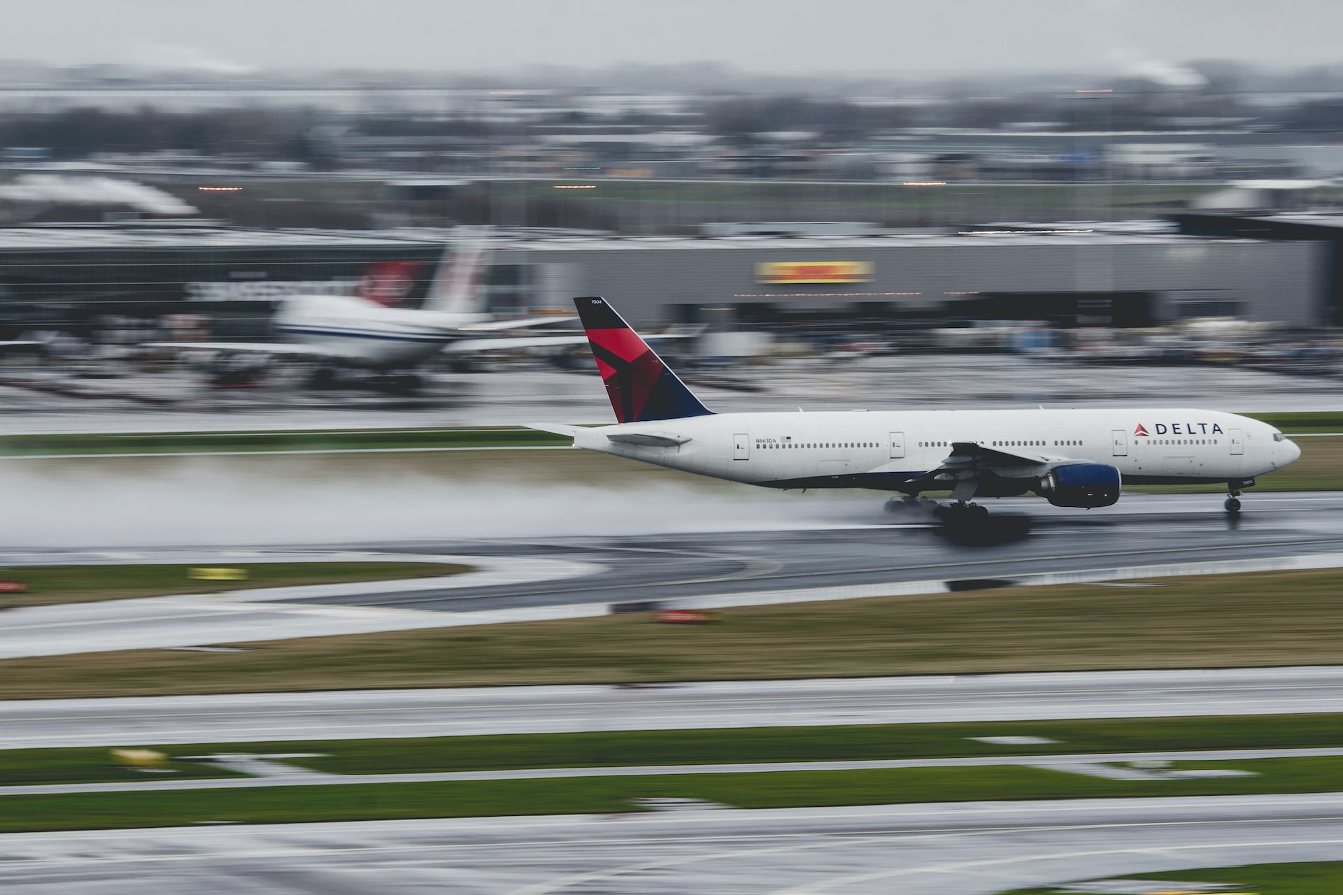 A Delta Airways aircraft accelerating to take off. 