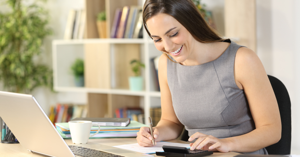 A woman reviewing her pretax income for her OnlyFans business at home