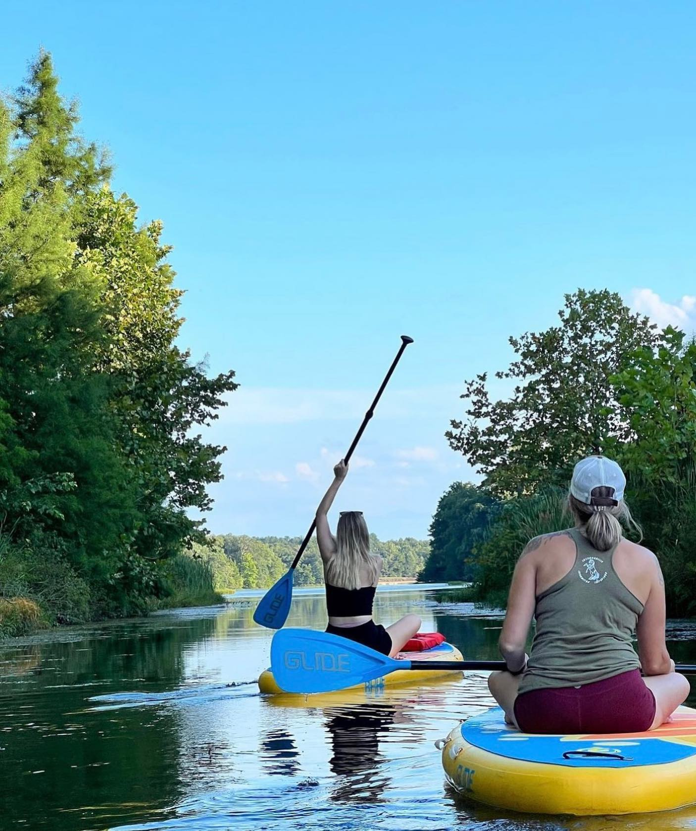 sitting on paddle boards