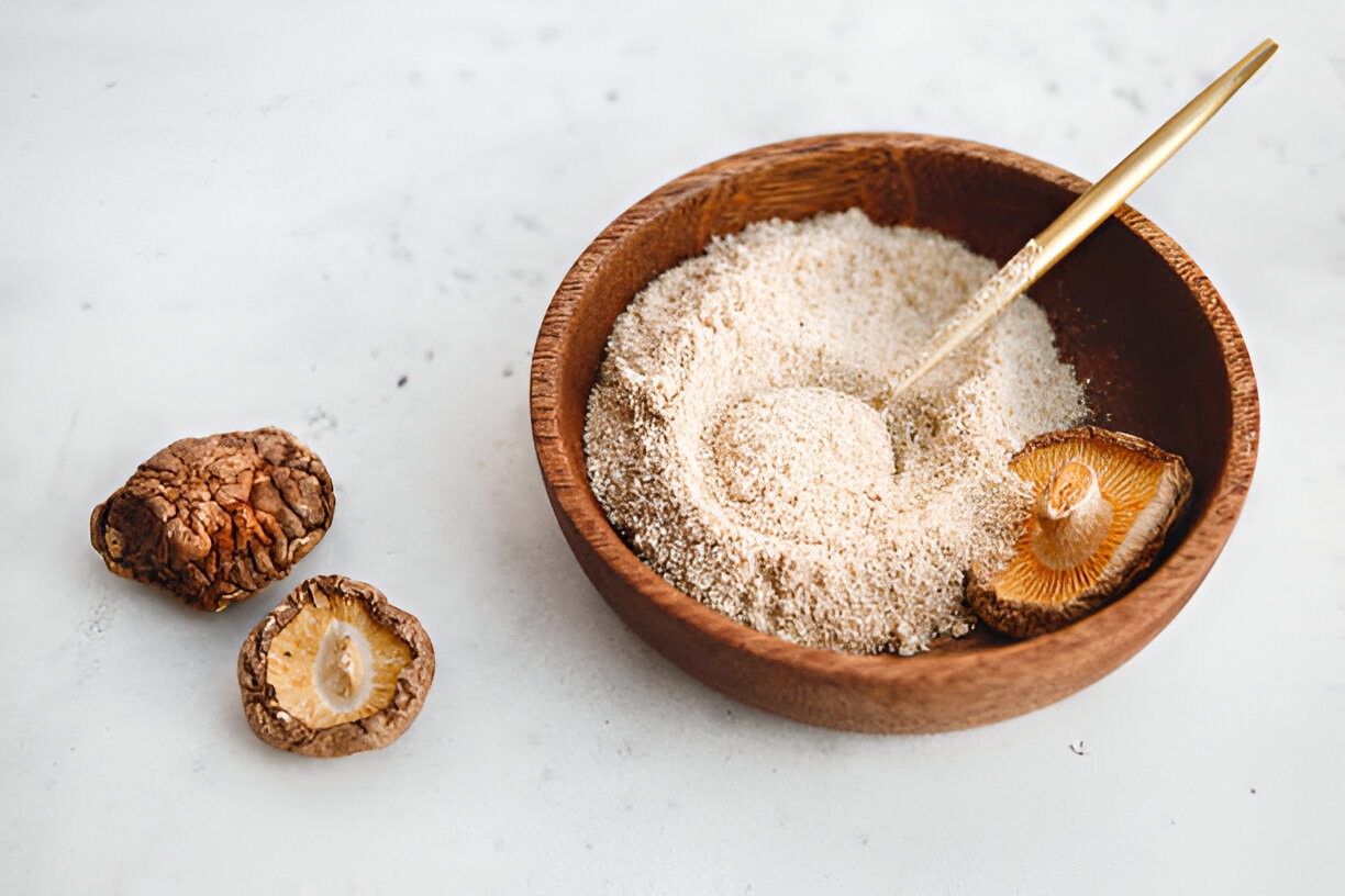 mushroom powder in a wooden bowl with spoon