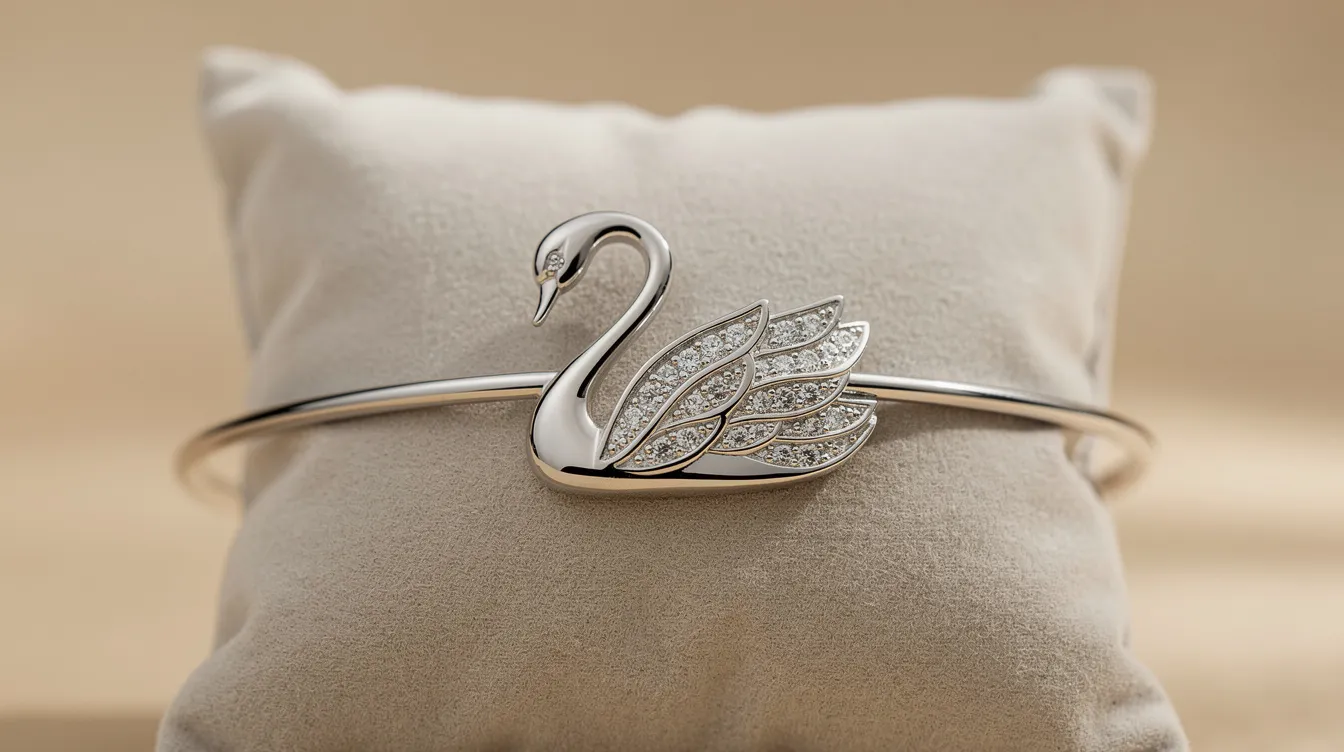 The image showcases an elegant swan bracelet featuring a stunning swan motif, crafted from high-quality materials and adorned with sparkling full cut crystals. This versatile double wrap bracelet, part of the Swarovski Remix Collection, highlights crisp clear pavé lines and a modern design that symbolizes grace and beauty.