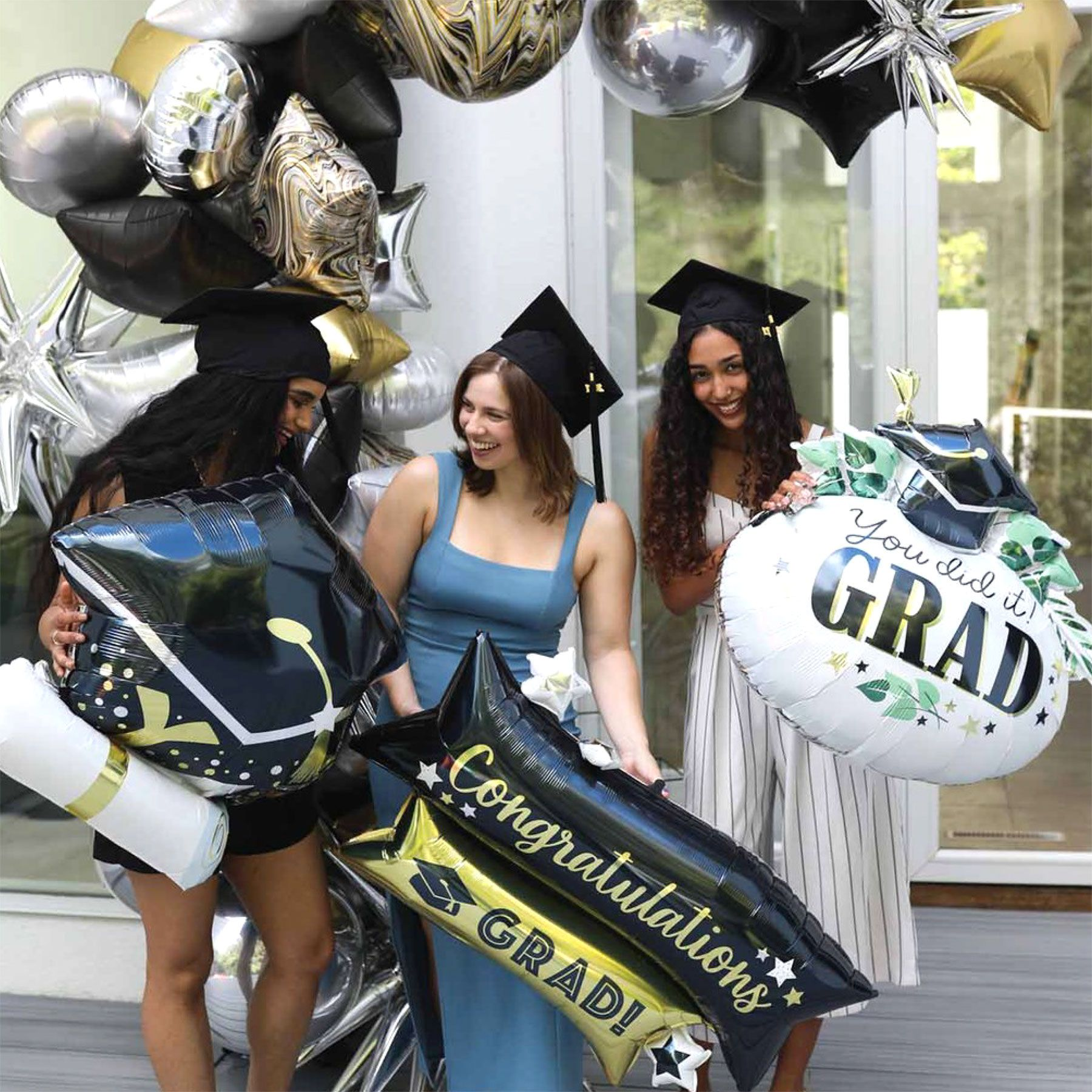 Graduation Party Idea #9:  Create a graduation balloon arch in your backyard .