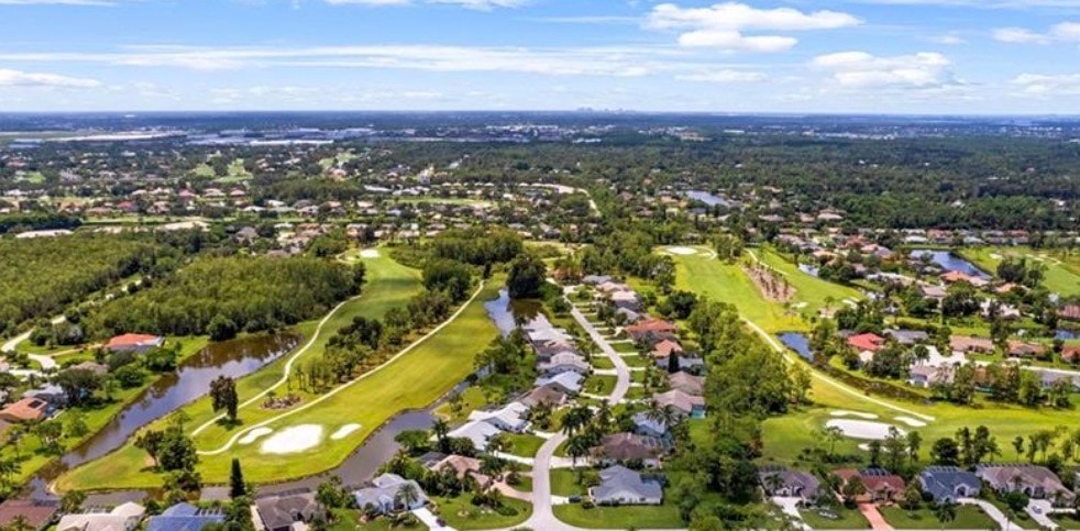 The image depicts a modern shopping center in Southwest Florida, featuring palm trees and inviting outdoor dining areas, typical of the vibrant lifestyle in Fort Myers. This community hub is perfect for those searching for Eagle Ridge homes for sale, offering a blend of shopping and dining experiences.